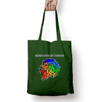 Green tote bag with a colorful lion with a rainbow coloured mane design and text held by a hand on a white background
