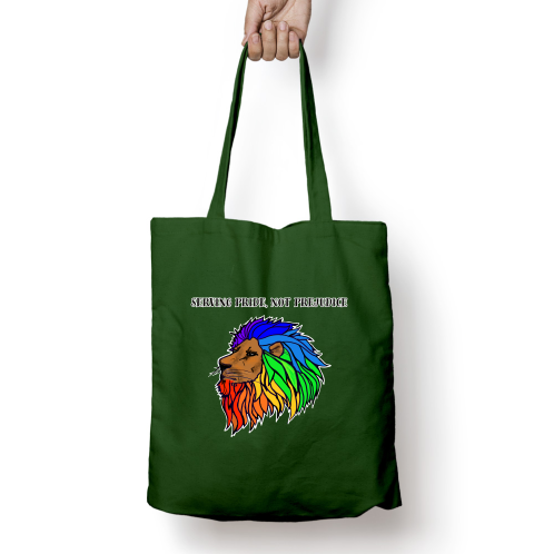 Green tote bag with a colorful lion with a rainbow coloured mane design and text held by a hand on a white background